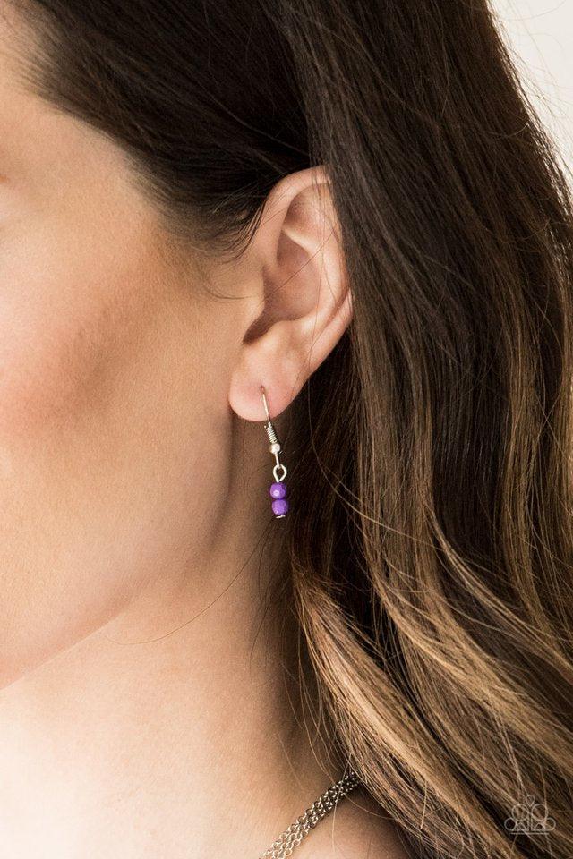 Paparazzi Accessories Mild Wild - Purple Infused with vivacious purple beading and an ornate silver teardrop pendant, a colorfully beaded strand gives way to a plain silver chain and a dainty silver chain featuring an antiqued pendant for a whimsically la
