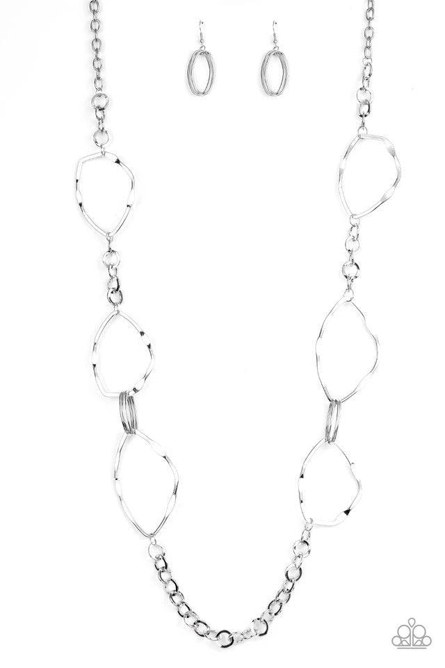 Paparazzi Accessories Abstract Artifact - Silver Mismatched sections of bold silver links, silver ovals, and flattened asymmetrical frames link across the chest for an abstract look. Features an adjustable clasp closure. Sold as one individual necklace. I