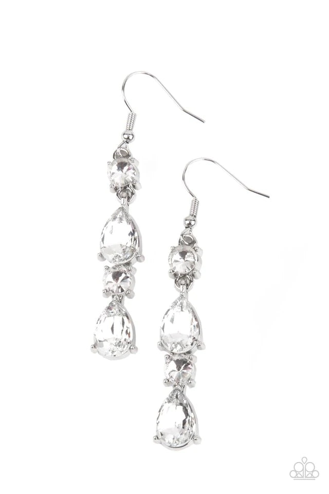 Paparazzi Accessories Raise Your Glass to Glamorous - White A glamorous collection of brilliant white teardrop and round rhinestones encased in classic silver pronged fittings stack together creating an irresistibly refined lure. Earring attaches to a sta