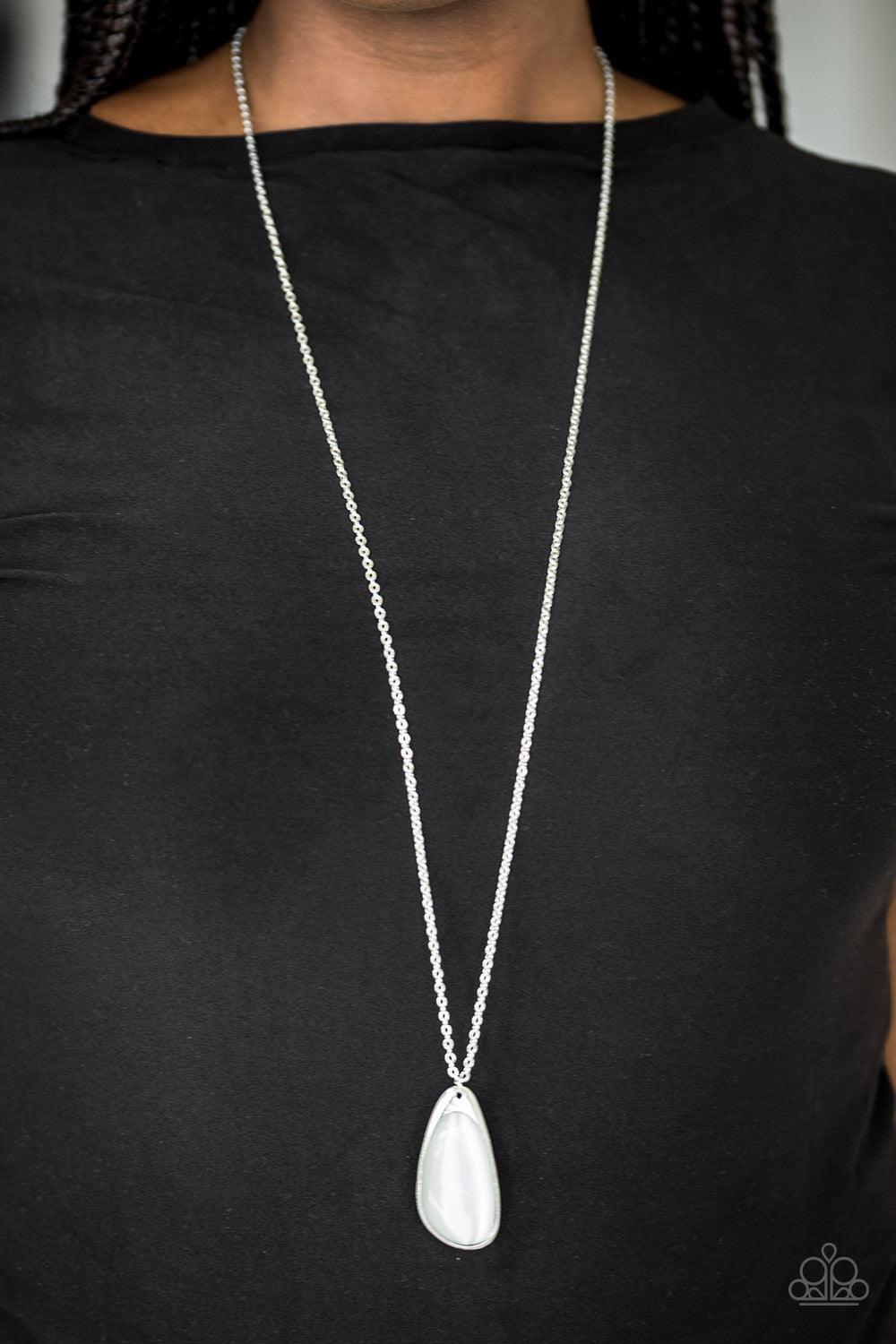 Paparazzi Accessories Magically Modern - White A glowing white moonstone is pressed into an asymmetrical silver frame, creating a whimsical pendant. Features an adjustable clasp closure. Sold as one individual necklace. Includes one pair of matching earri