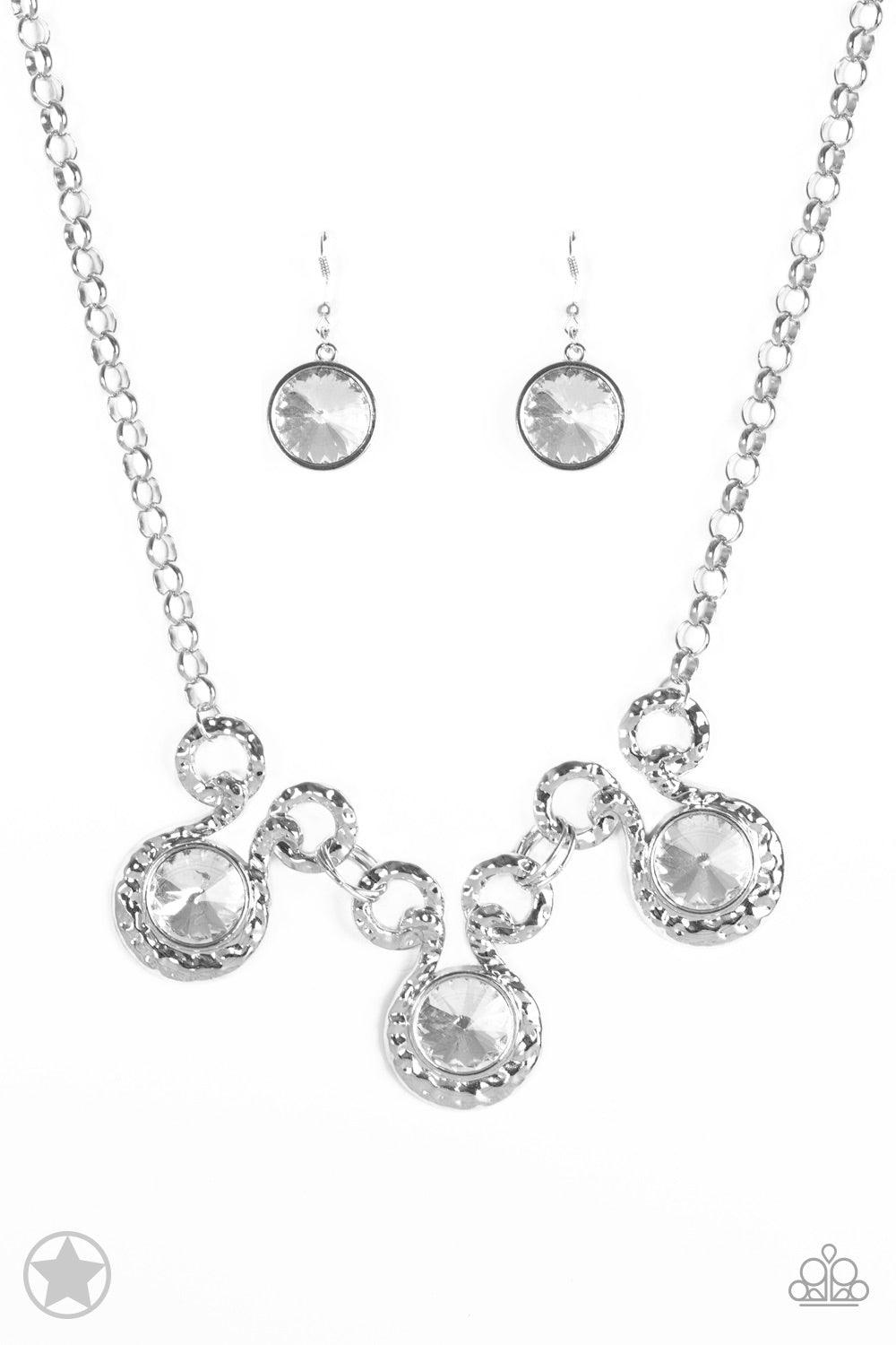 Paparazzi Accessories Hypnotized - Silver Three dramatically oversized rhinestones are nestled into three textured silver fittings that are connected by oval silver rings, creating a brilliant statement piece. Features an adjustable clasp closure. Jewelry