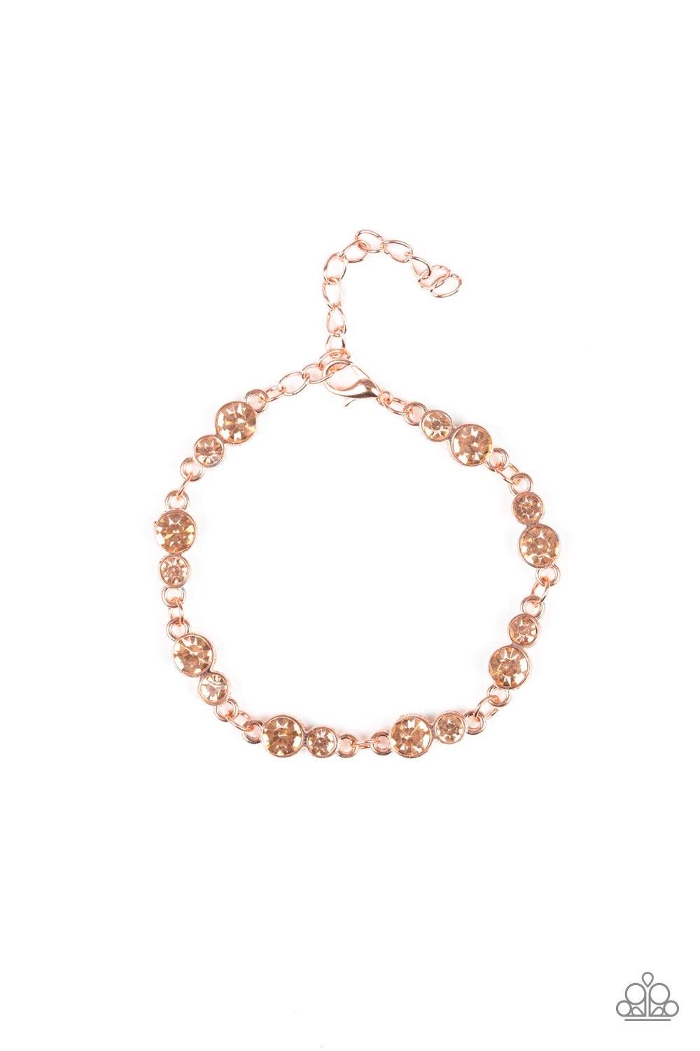 Paparazzi Accessories Twinkle Twinkle Little STARLET ~Copper Varying in size, pairs of glassy peach rhinestones are encrusted along shiny copper frames and linked around the wrist for a timeless finish. Features an adjustable clasp closure. Sold as one in