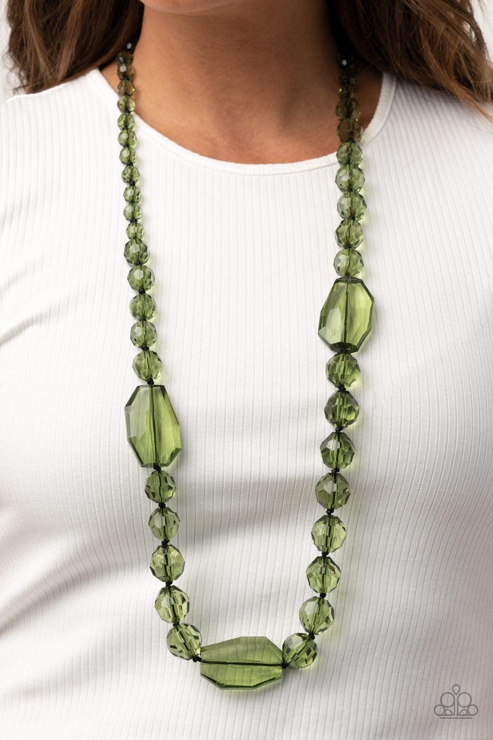 Paparazzi Accessories Malibu Masterpiece - Green Varying in shape and size, glassy green beads are knotted in place along shiny black cording, creating a dazzling display across the chest. Features an adjustable clasp closure. Sold as one individual neckl
