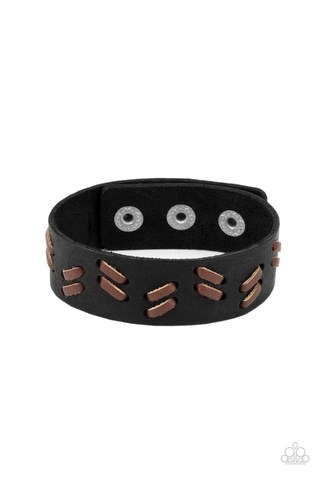 Paparazzi Accessories Suburban Wrangler - Black Brown leather laces are decoratively threaded through a black leather band, creating a rustic pattern around the wrist. Features an adjustable snap closure. Jewelry