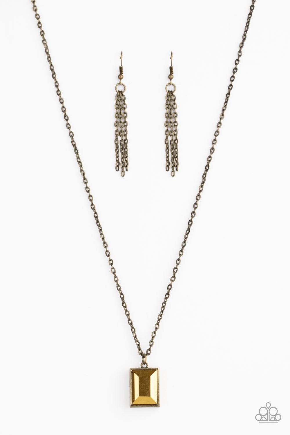 Paparazzi Accessories Pro-Edge - Brass Featuring an emerald style cut, a faceted aurum gem is pressed into a sleek brass frame at the bottom of a dainty brass chain below the collar for an edgy look. Features an adjustable clasp closure. Sold as one indiv