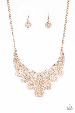 Paparazzi Accessories Mess With The Bull - Gold Embossed in whimsical floral detail, shimmery gold plates connect below the collar for a statement making look. Features an adjustable clasp closure. Sold as one individual necklace. Includes one pair of mat