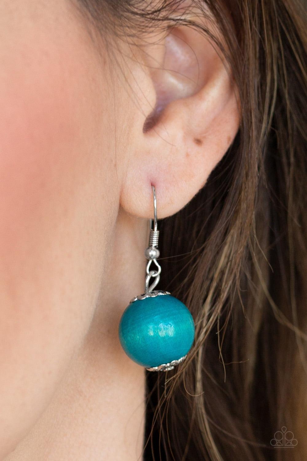 Paparazzi Accessories Caribbean Cover Girl - Blue Brushed in a distressed finish, refreshing blue wooden beads and discs join below the collar for a summery look. Features a button loop closure. Jewelry