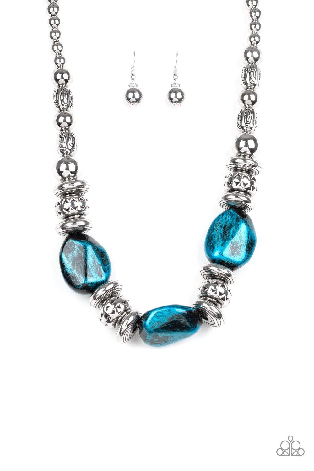 Paparazzi Accessories Colorfully Confident - Blue A collection of classic silver beads, ornate silver accents, and metallic blue faux rock beads are threaded along an invisible wire below the collar for a statement-making finish. Features an adjustable cl