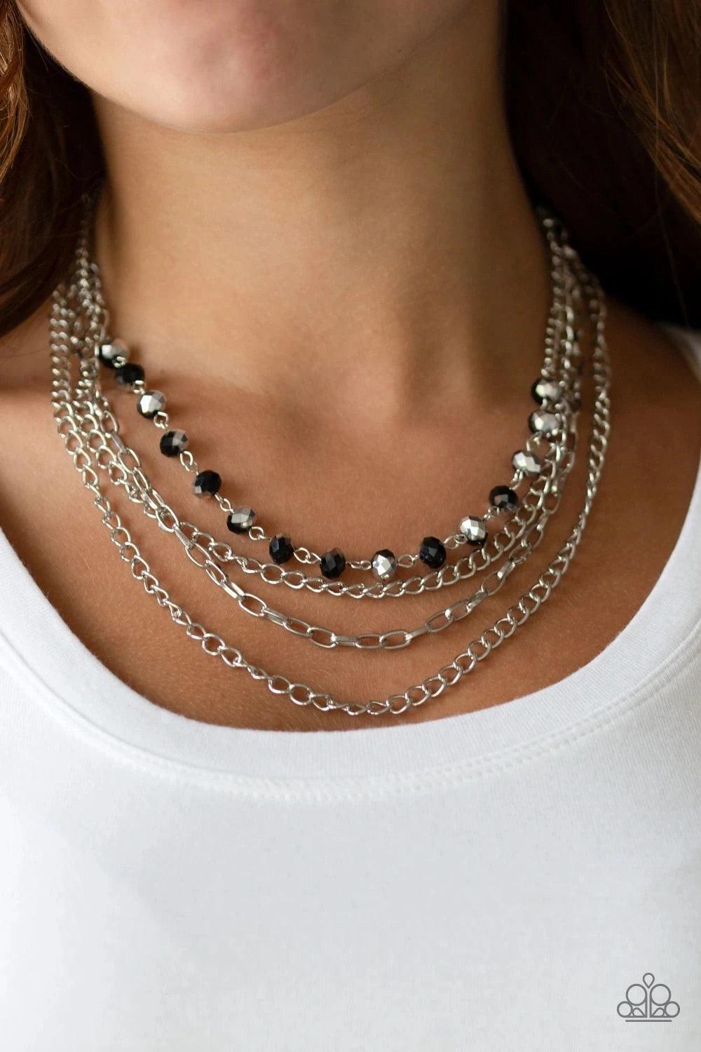 Paparazzi Accessories Extravagant Elegance - Multi Mismatched silver chains layer down the chest. Dipped in a metallic sheen, a strand of faceted black beads join below the collar for a glamorous look. Features an adjustable clasp closure. Sold as one ind