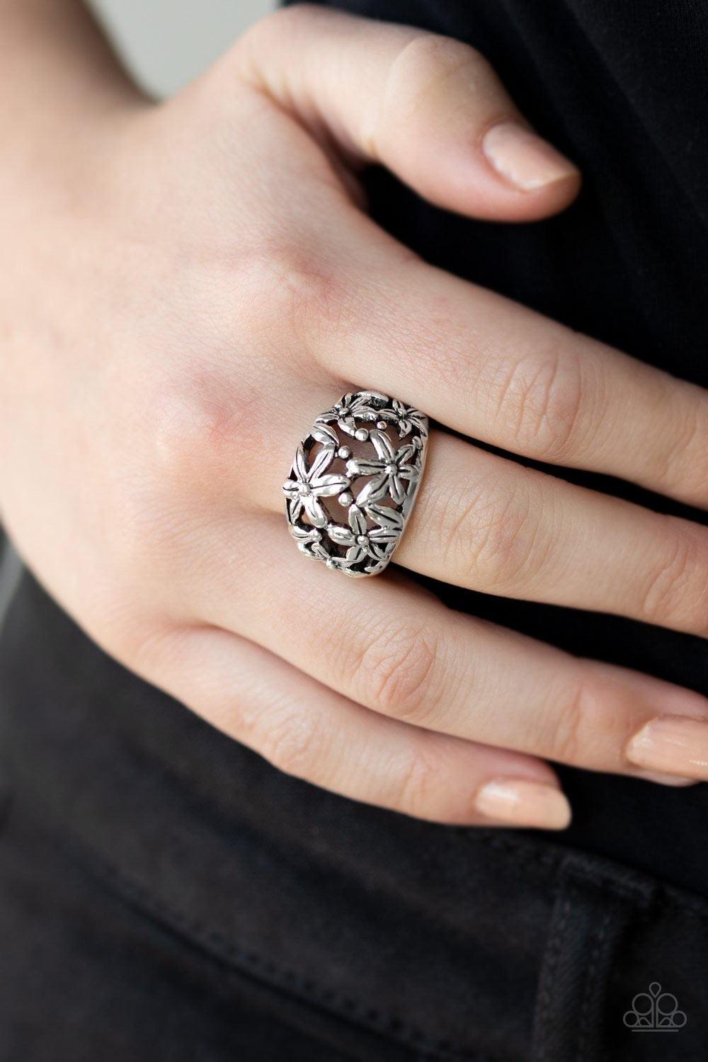 Paparazzi Accessories Haute Havana - Silver Brushed in antiqued details, glistening silver flowers bloom across the finger, coalescing into a whimsical band. Features a stretchy band for a flexible fit. Jewelry