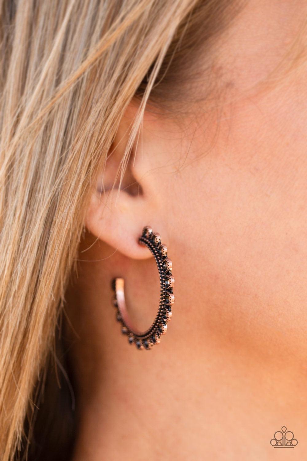 Paparazzi Accessories Bohemian Bliss - Copper Radiating with studded copper petals, an ornate copper hoop curls around the ear for a seasonal look. Earring attaches to a standard post fitting. Hoop measures 1 1/4" in diameter. Jewelry