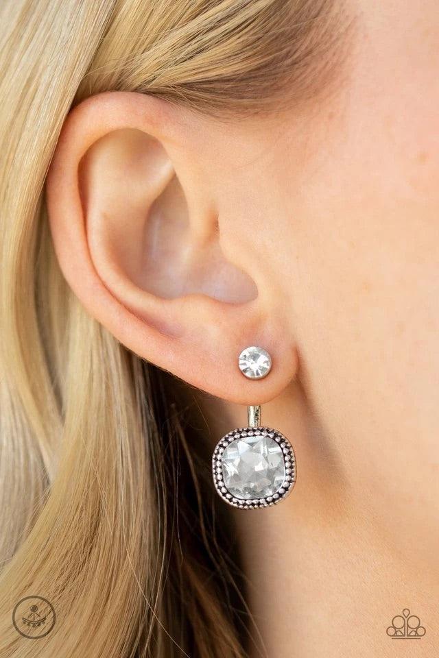 Paparazzi Accessories Celebrity Cache - White A solitaire white rhinestone attaches to a double-sided post, designed to fasten behind the ear. Featuring a faceted white gem, the glitzy double-sided post peeks out beneath the ear for a refined look. Earrin