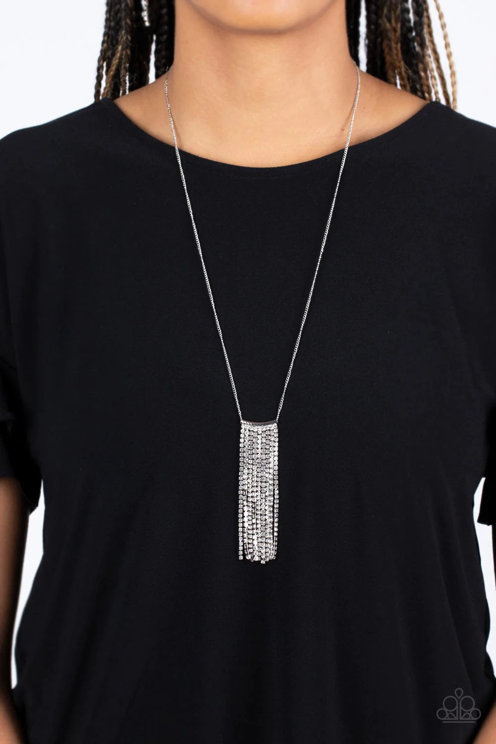 Paparazzi Accessories Stellar Crescendo - White A silver chain holding cascades of glittery white rhinestones, waterfall down the chest. The exaggerated tassels glitter at the bottom of an extended silver chain, adding extra refinement to the statement pi