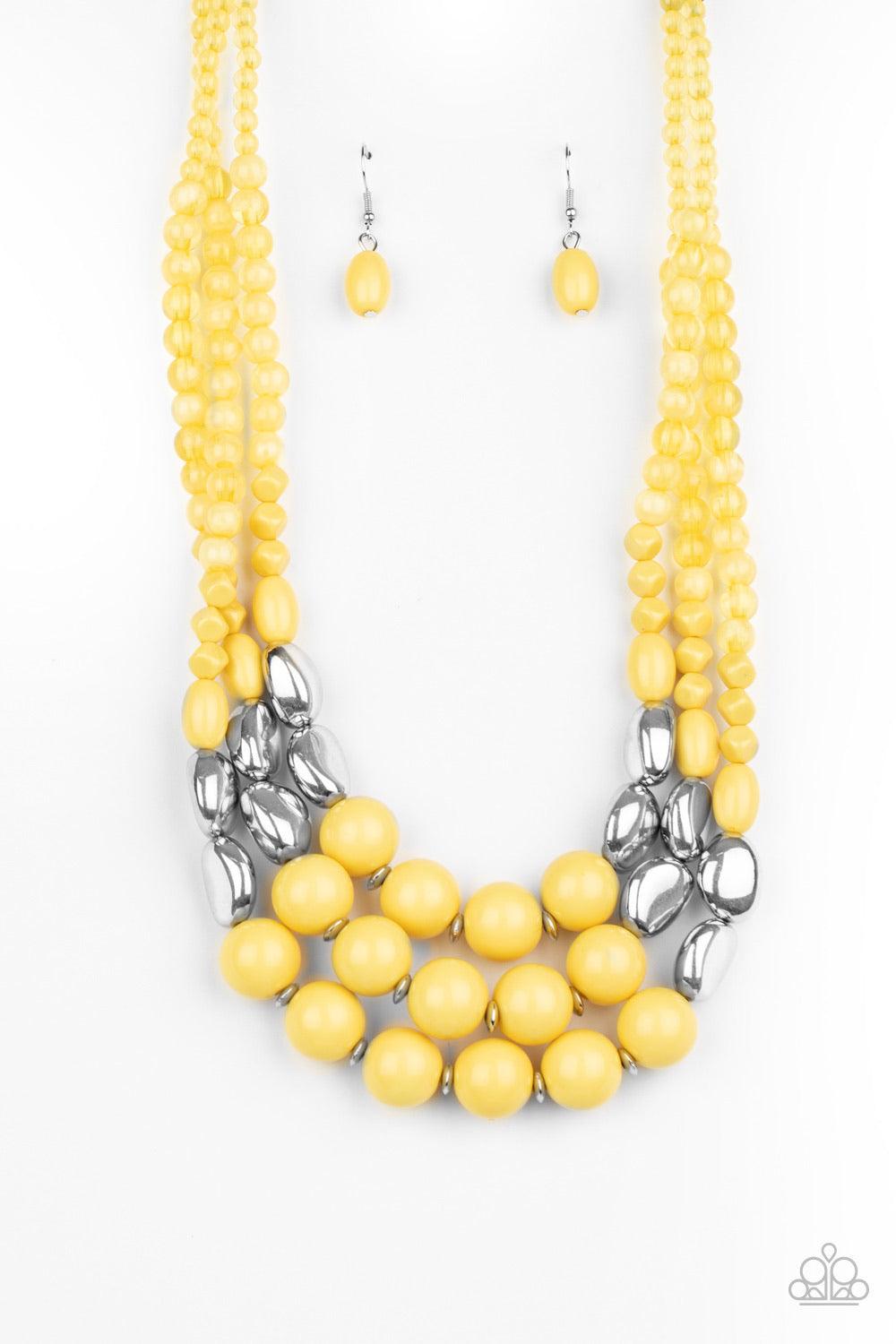 Paparazzi Accessories Flamingo Flamboyance - Yellow Featuring polished and glassy finishes, imperfect yellow and silver beads are threaded along three invisible wires, creating colorful layers below the collar. Features an adjustable clasp closure. Sold a