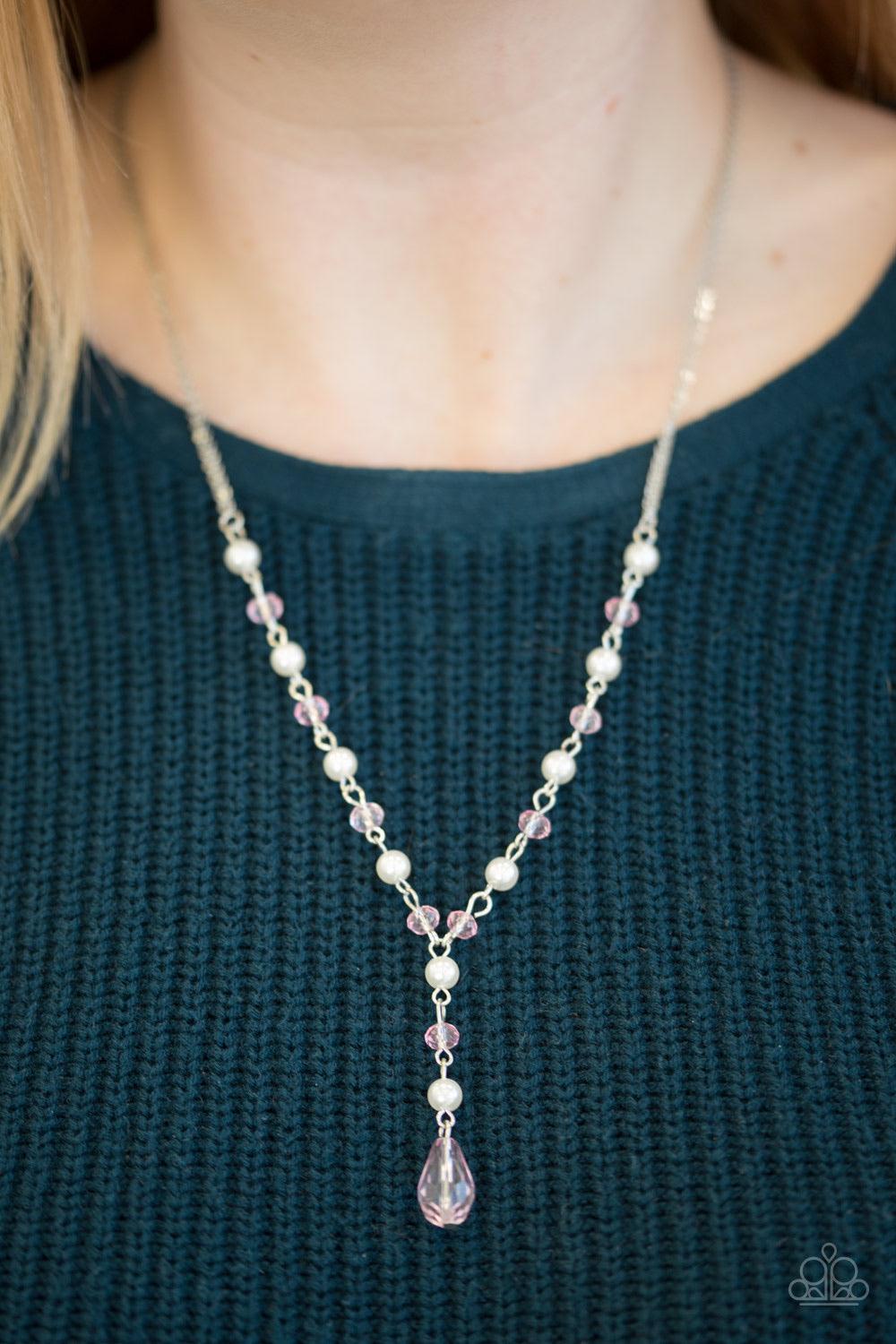 Paparazzi Accessories Diva Deluxe - Pink Dainty white pearls alternate with pink crystal-like beading along a silver chain. An extension of pearls and crystal beading cascades from the chain, giving way to a dramatic teardrop pendant for a vintage inspire