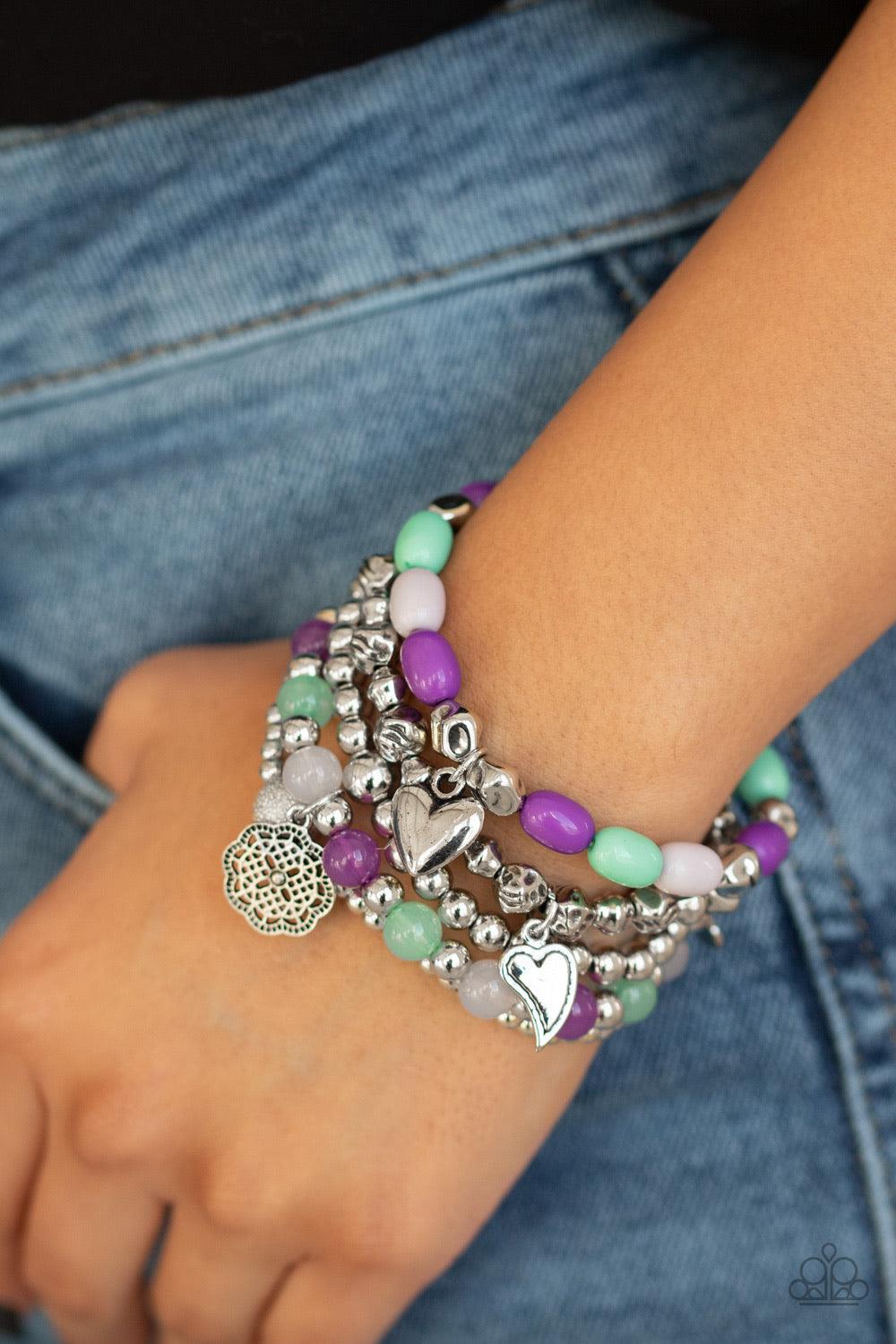 Paparazzi Accessories No CHARM Done - Multi A mismatched collection of silver charms, cloudy and polished multicolored beads, and shimmery silver beads are threaded along stretchy bands around the wrist for a charmingly layered look. Jewelry