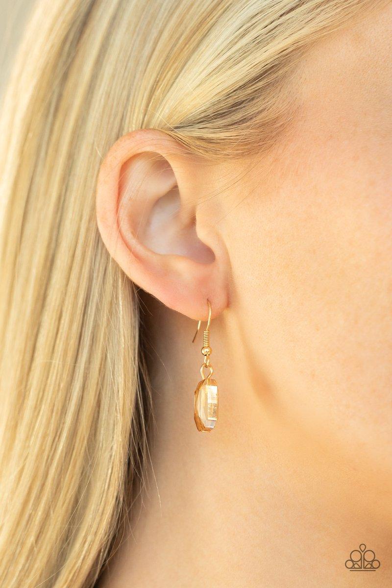Paparazzi Accessories Heard It On The Heir-Waves ~Gold Gorgeously oversized golden emerald cut gems fabulously link below the collar, creating an iridescently icy statement piece. Features an adjustable clasp closure. Sold as one individual necklace. Incl