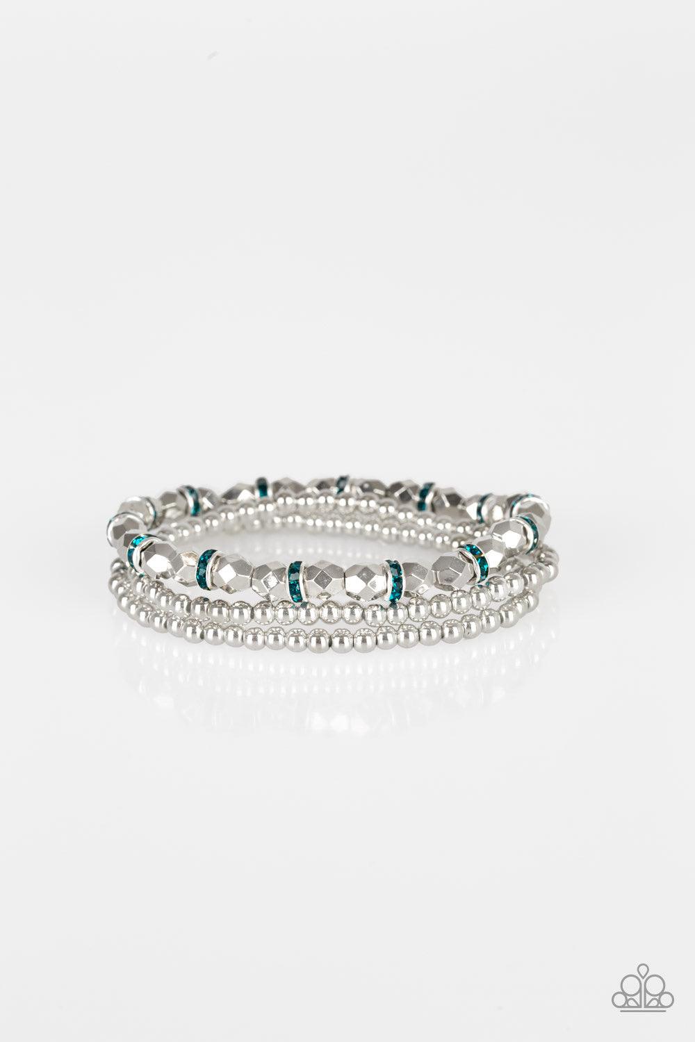 Paparazzi Accessories Let There BEAM Light - Blue Infused with blue rhinestone encrusted rings, mismatched dainty silver and faceted silver beads are threaded along stretchy bands for a refined look. Jewelry