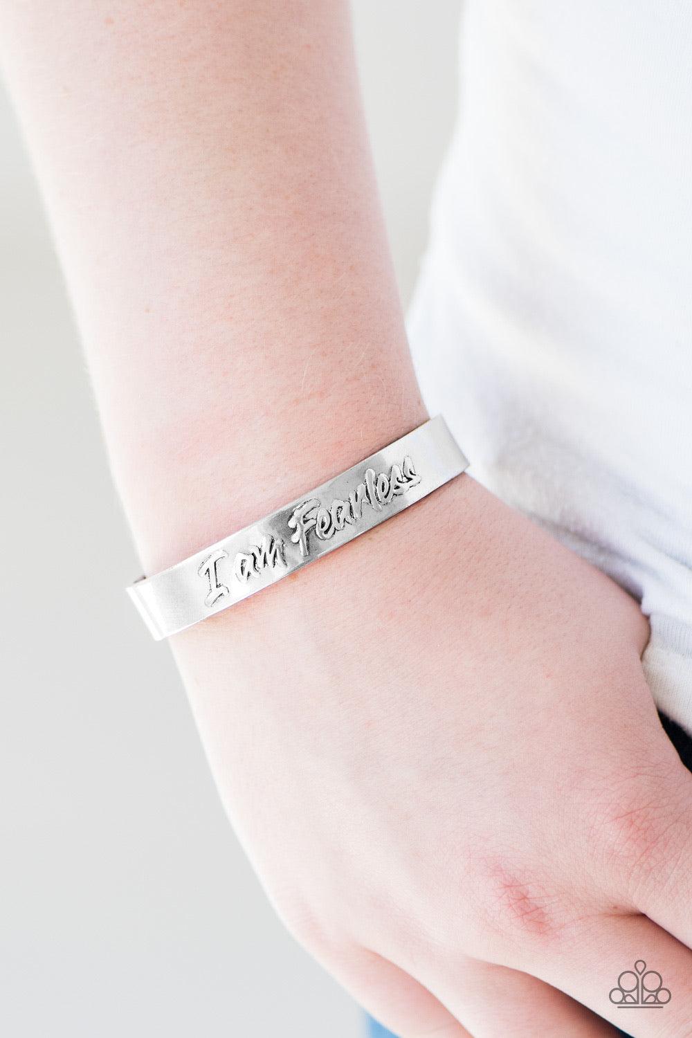 Paparazzi Accessories I Am Fearless - Silver Brushed in an antiqued finish, a silver cuff is embossed in the phrase “I am Fearless” for a fierce finish. Sold as one individual bracelet. Jewelry