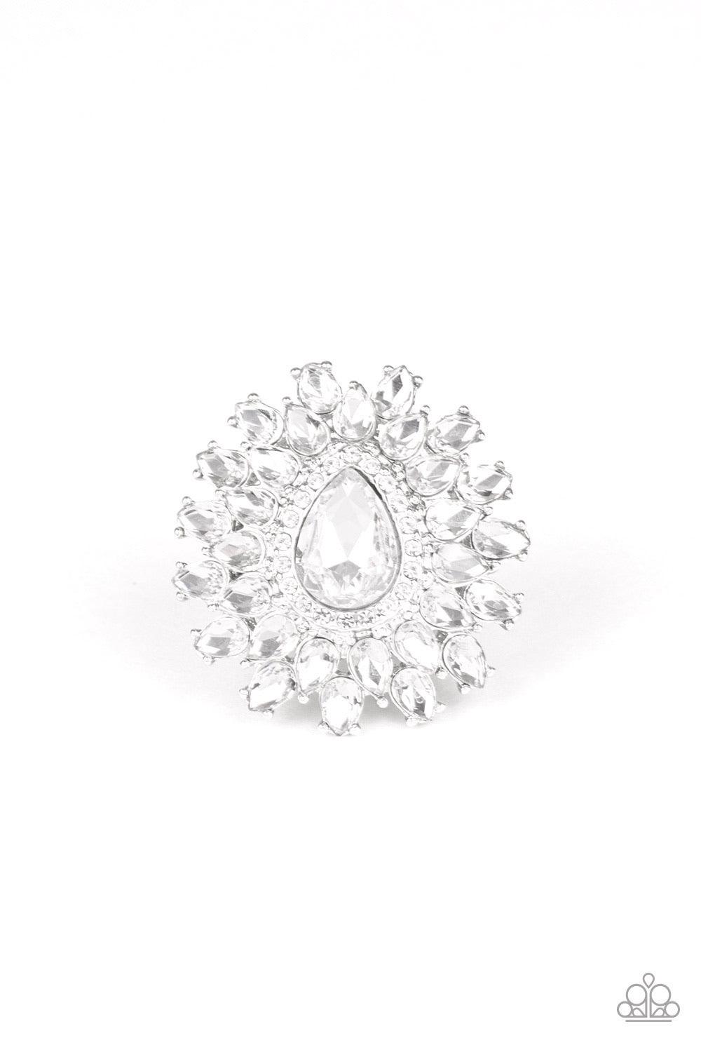 Paparazzi Accessories Who’s Counting ~White White teardrop petals fan out from a dramatically oversized white teardrop rhinestone center, stacking into a glamorous centerpiece atop the finger. Features a stretchy band for a flexible fit. Sold as one indiv