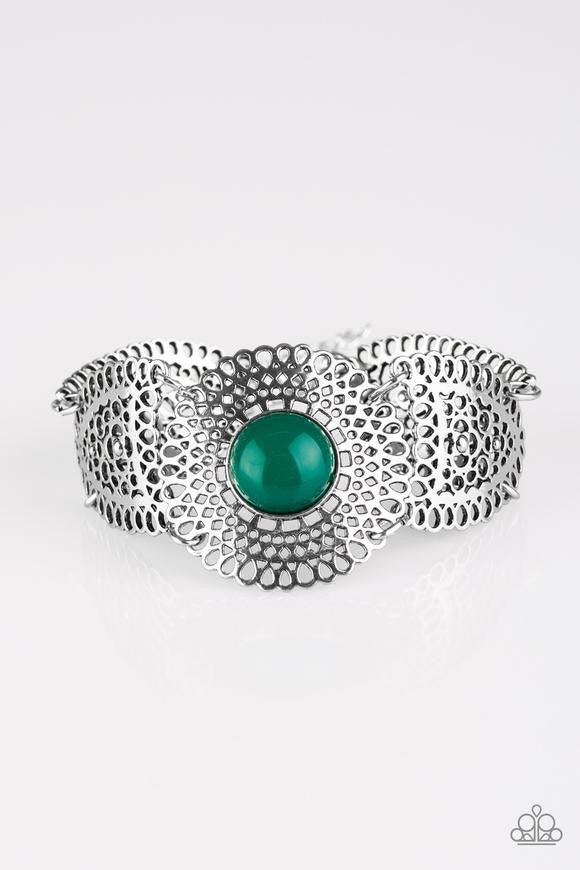 Paparazzi Accessories Avant-VANGUARD - Green Featuring lace-like patterns, stenciled silver frames connect across the wrist in a whimsical fashion. A rich Quetzal Green bead is pressed into the round center frame for a colorful seasonal finish. Features a