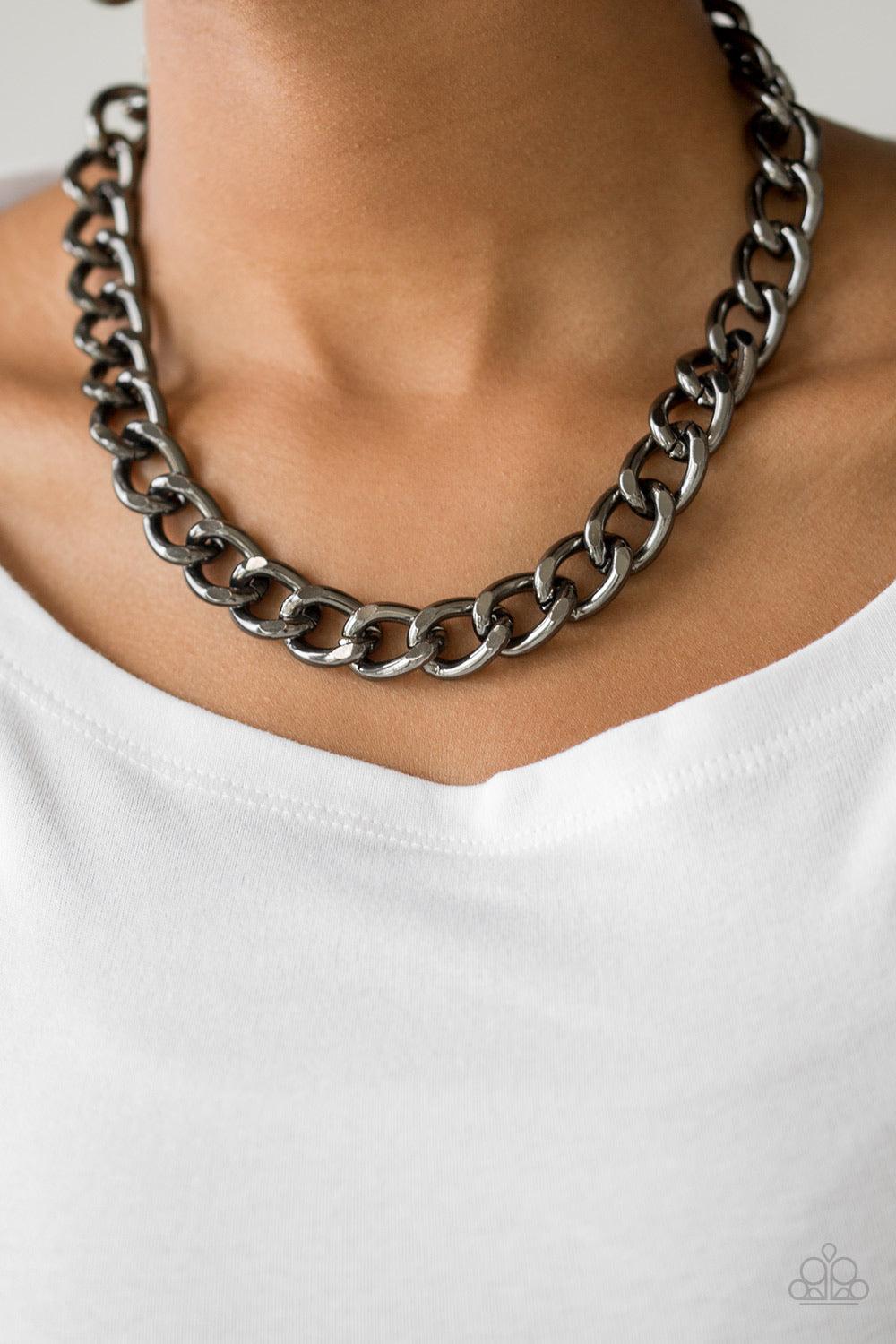 Paparazzi Accessories Heavyweight Champion - Black Brushed in a high-sheen shimmer, a bold gunmetal chain drapes below the collar in an edgy industrial fashion. Features an adjustable clasp closure. Sold as one individual necklace. Includes one pair of ma