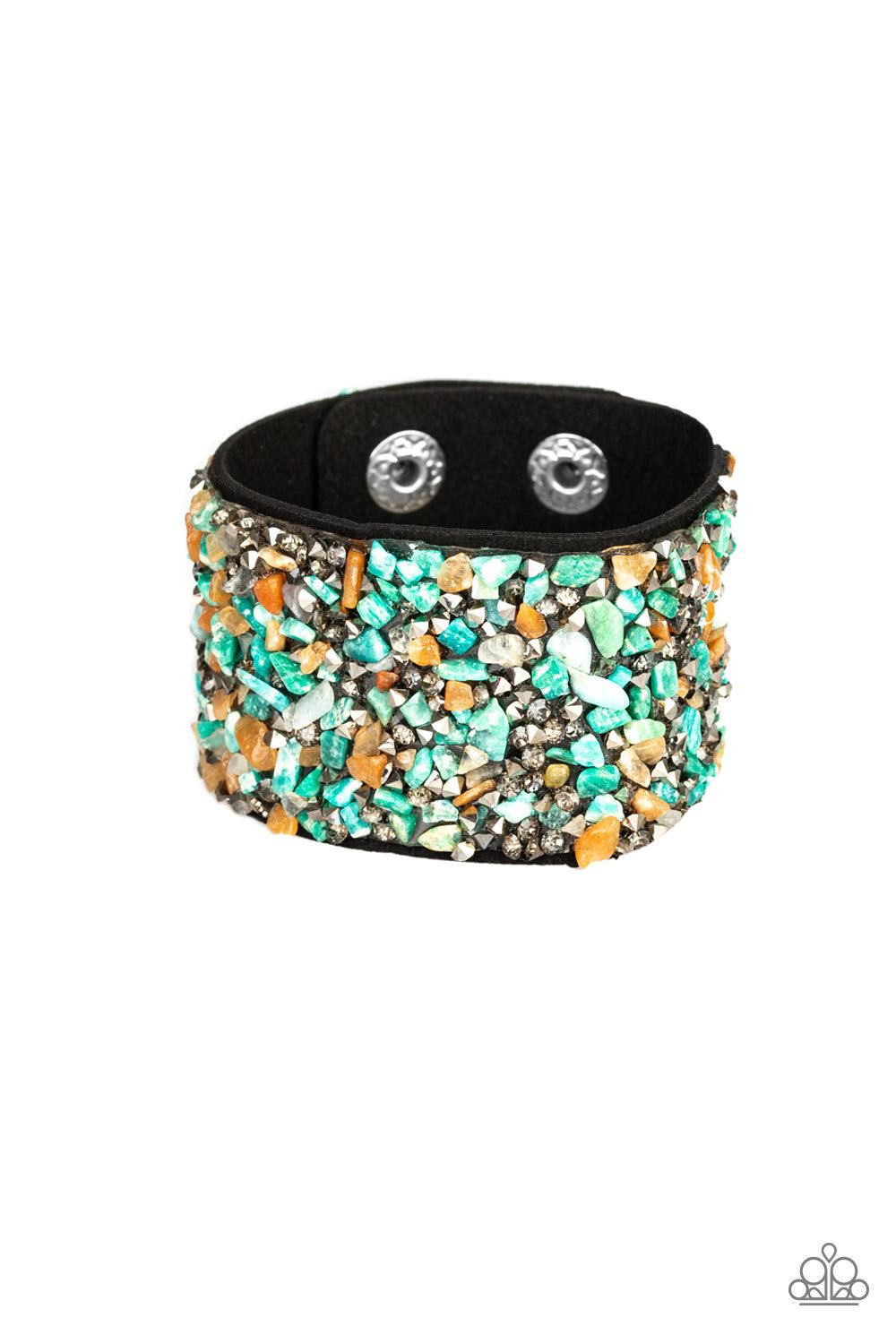 Paparazzi Accessories Crush Rush ~Multi Smoky and hematite prism style rhinestones and bits of crushed multicolored rock are sprinkled across a thick black suede band for an edgy look. Features an adjustable snap closure. Sold as one individual bracelet.
