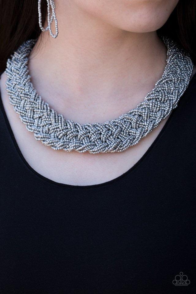 Paparazzi Accessories Mesmerizingly Mesopotamia - Silver Brushed in a flashy shimmer, metallic seed beads braid into an indigenous braid below the collar for a seasonal look. Features an adjustable clasp closure. Sold as one individual necklace. Includes