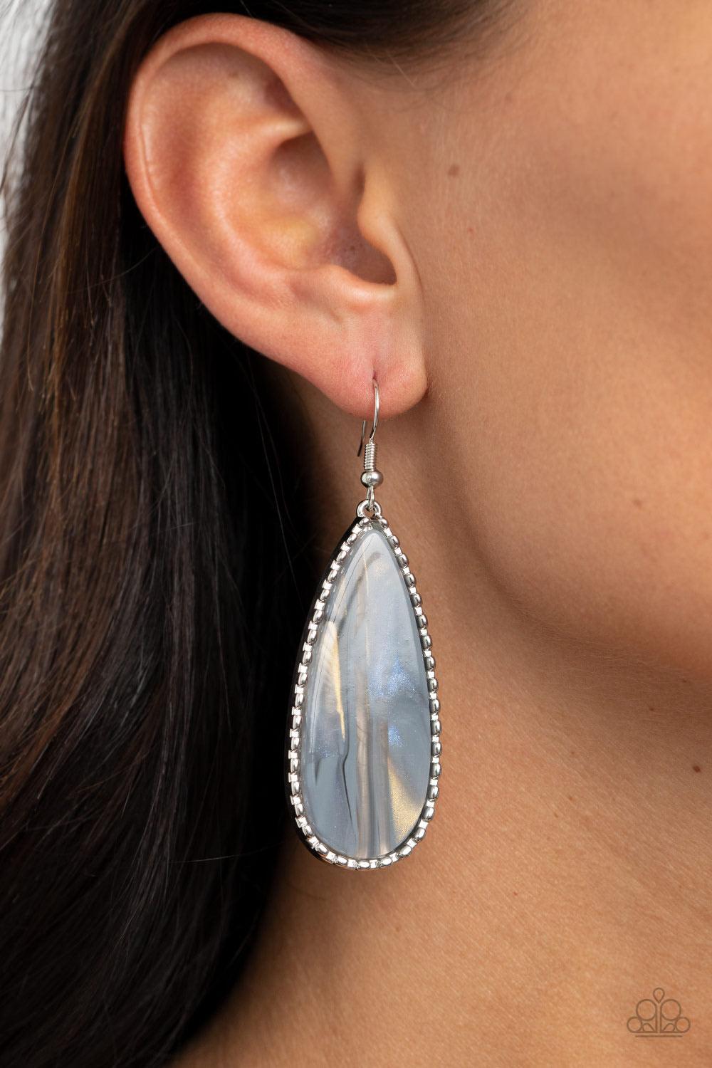 Paparazzi Accessories Ethereal Eloquence - Silver Featuring a shell-like shimmer, a faux marble acrylic teardrop is encased into a studded silver frame for an ethereally refined fashion. Earring attaches to a standard fishhook fitting. Sold as one pair of