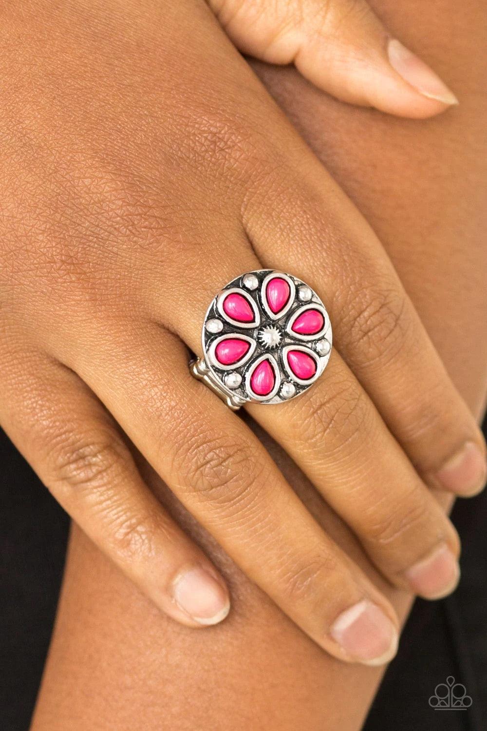 Paparazzi Accessories Color Me Calla Lily - Pink Vivacious pink beads are pressed into a studded silver frame, creating a colorful floral centerpiece atop the finger. Features a stretchy band for a flexible fit. Sold as one individual ring. Jewelry