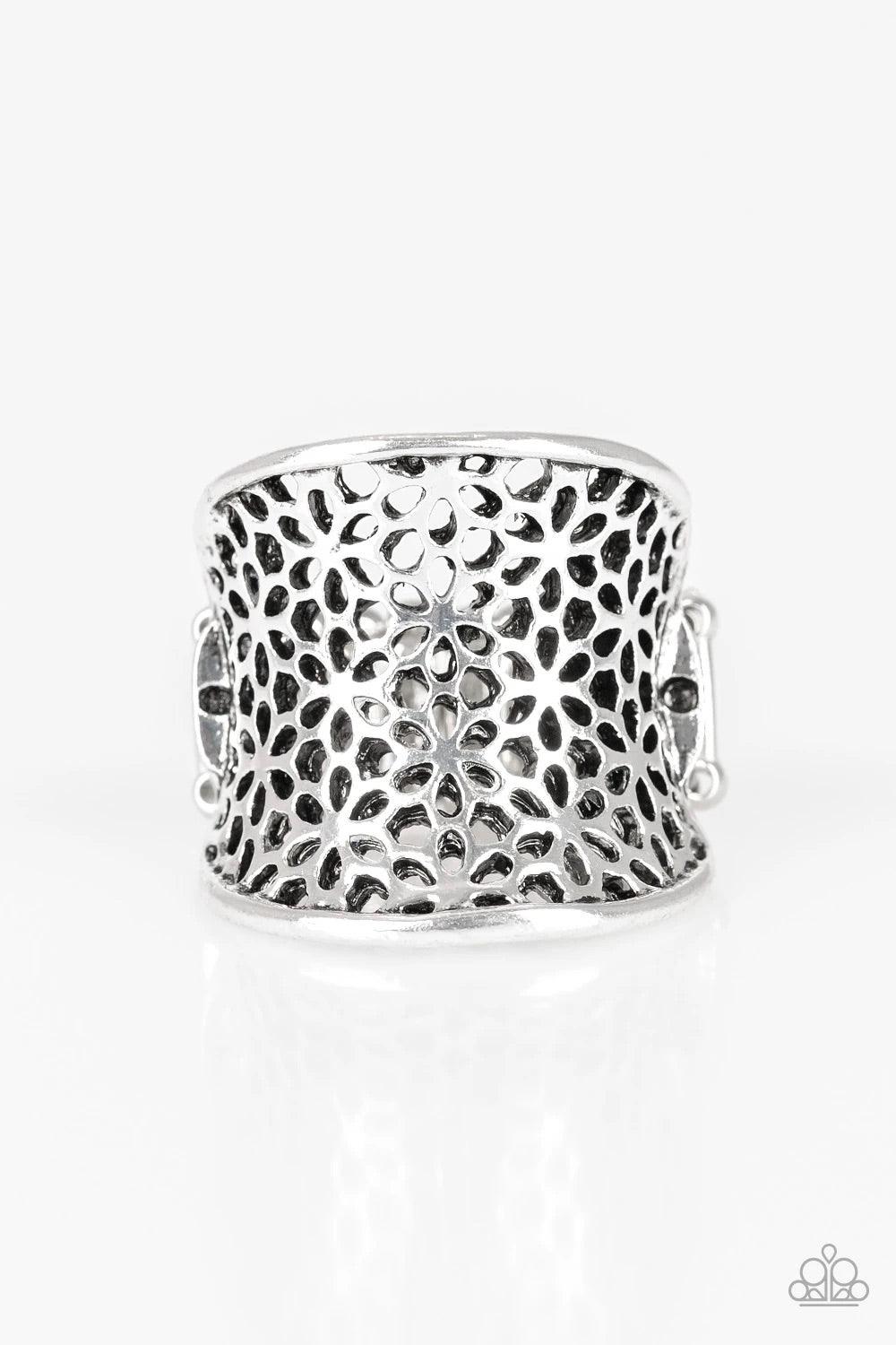 Paparazzi Accessories Garden Safari- Silver Stenciled in an airy floral pattern, a thick silver band curls around the finger for a whimsical springtime look. Features a stretchy band for a flexible fit. Sold as one individual ring. Jewelry