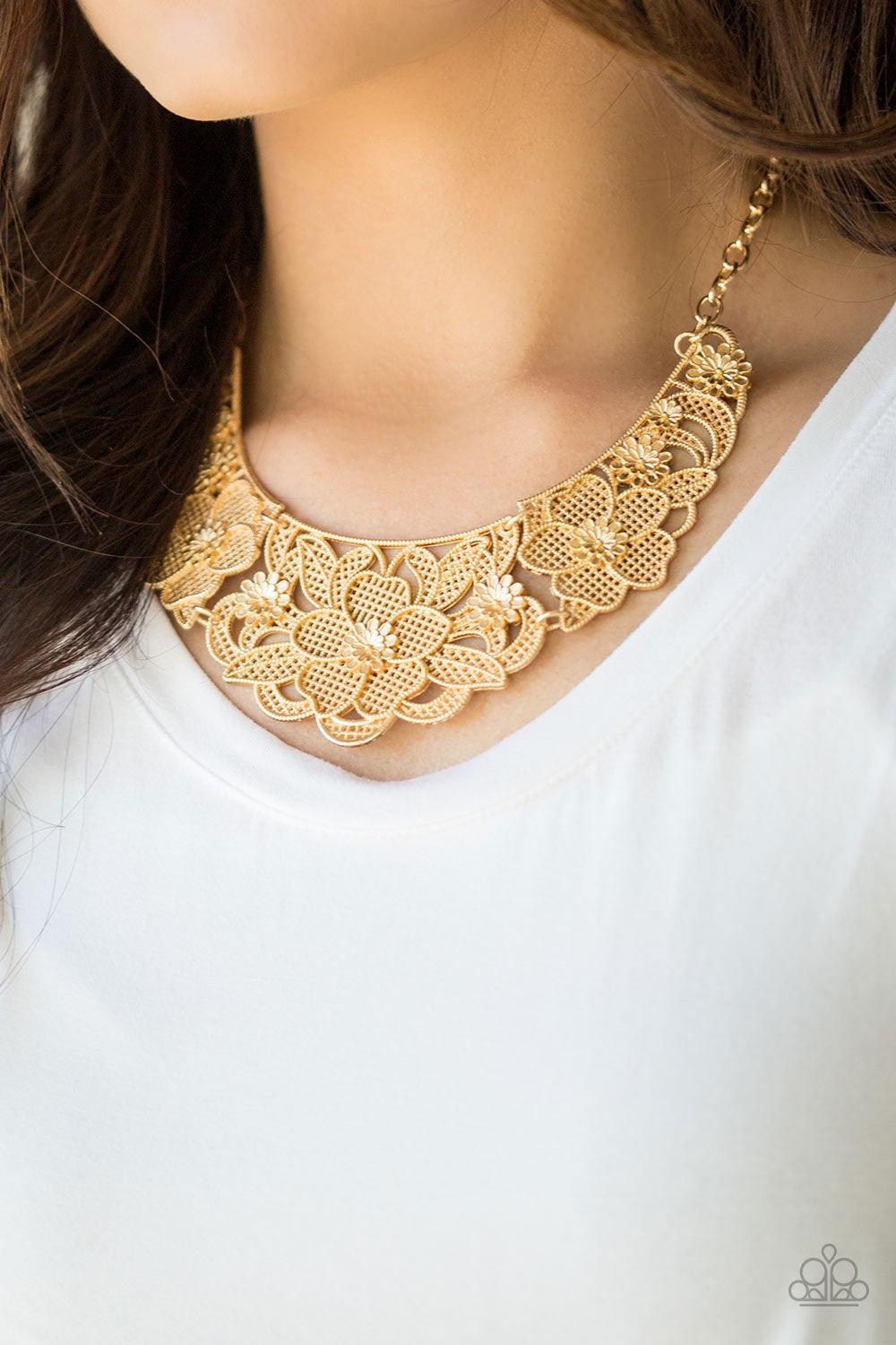Paparazzi Accessories Petunia Paradise - Gold Featuring lattice-like patterns, shimmery gold flowers bloom below the collar for a seasonal look. Features an adjustable clasp closure. Jewelry