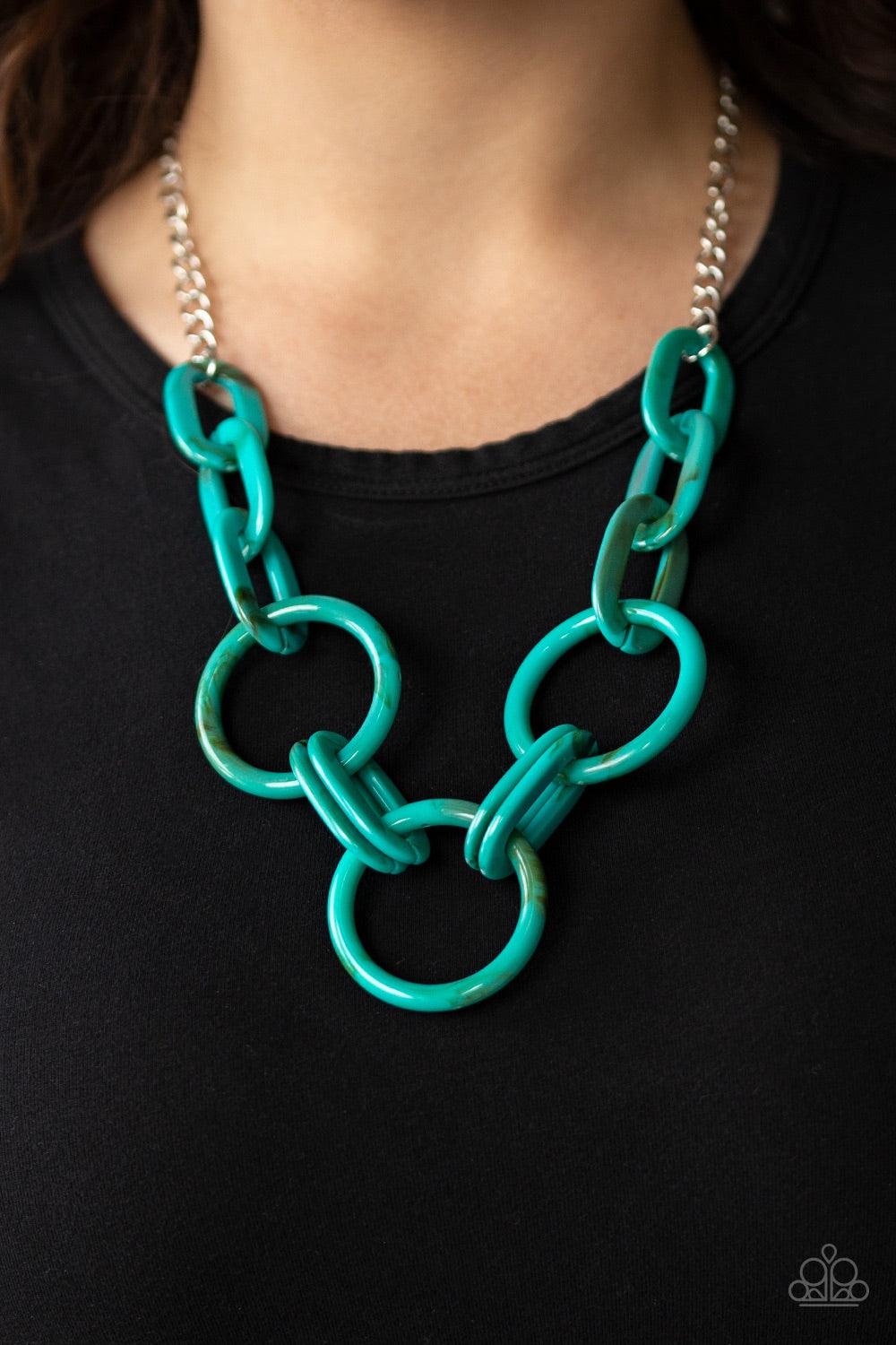 Paparazzi Accessories Turn Up The Heat - Blue Suspended from a shimmery silver chain, a collision of acrylic blue links connect below the collar in a statement-making fashion. Features an adjustable clasp closure. Jewelry