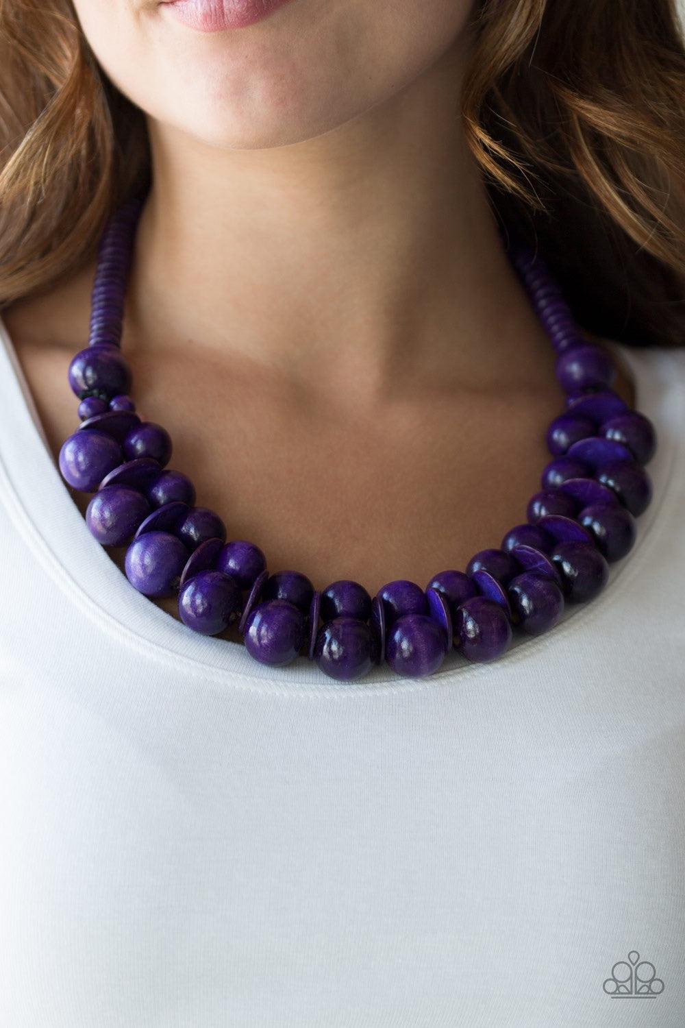 Paparazzi Accessories Caribbean Cover Girl - Purple Brushed in a distressed finish, vivacious purple wooden beads and discs join below the collar for a summery look. Features a button loop closure. Jewelry