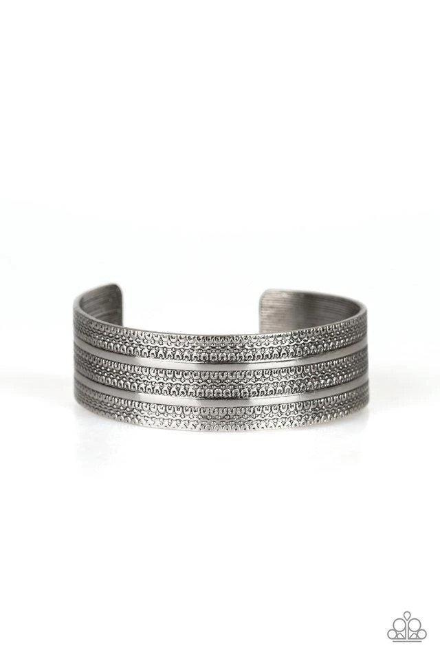 Paparazzi Accessories Patterned Plains - Silver Brushed in an antiqued shimmer, flat silver ribbons race across a silver cuff embossed in tactile textures for a tribal inspired flair. Sold as one individual bracelet. Jewelry