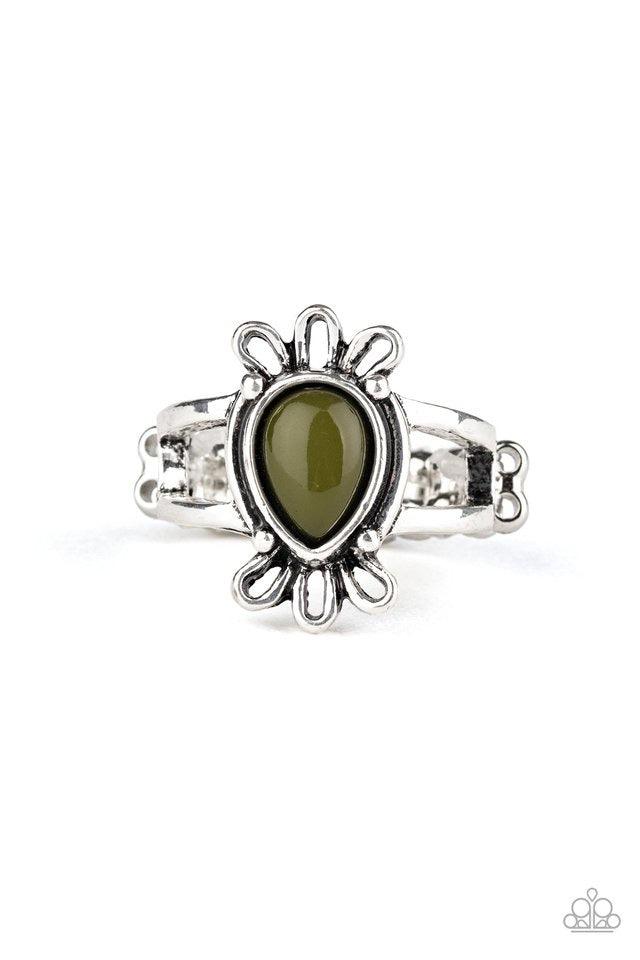 Paparazzi Accessories Tranquil Tide - Green A polished Military Olive teardrop bead is pressed into the center of a dainty silver band featuring a frilly silver frame. Features a dainty stretchy band for a flexible fit. Sold as one individual ring. Jewelr