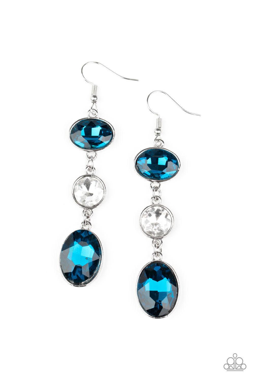 Paparazzi Accessories The GLOW Must Go On! - Blue Encased in sleek silver frames, mismatched blue oval and round white rhinestones trickle from the ear, creating an elegant lure. Earring attaches to a standard fishhook fitting. Sold as one pair of earring