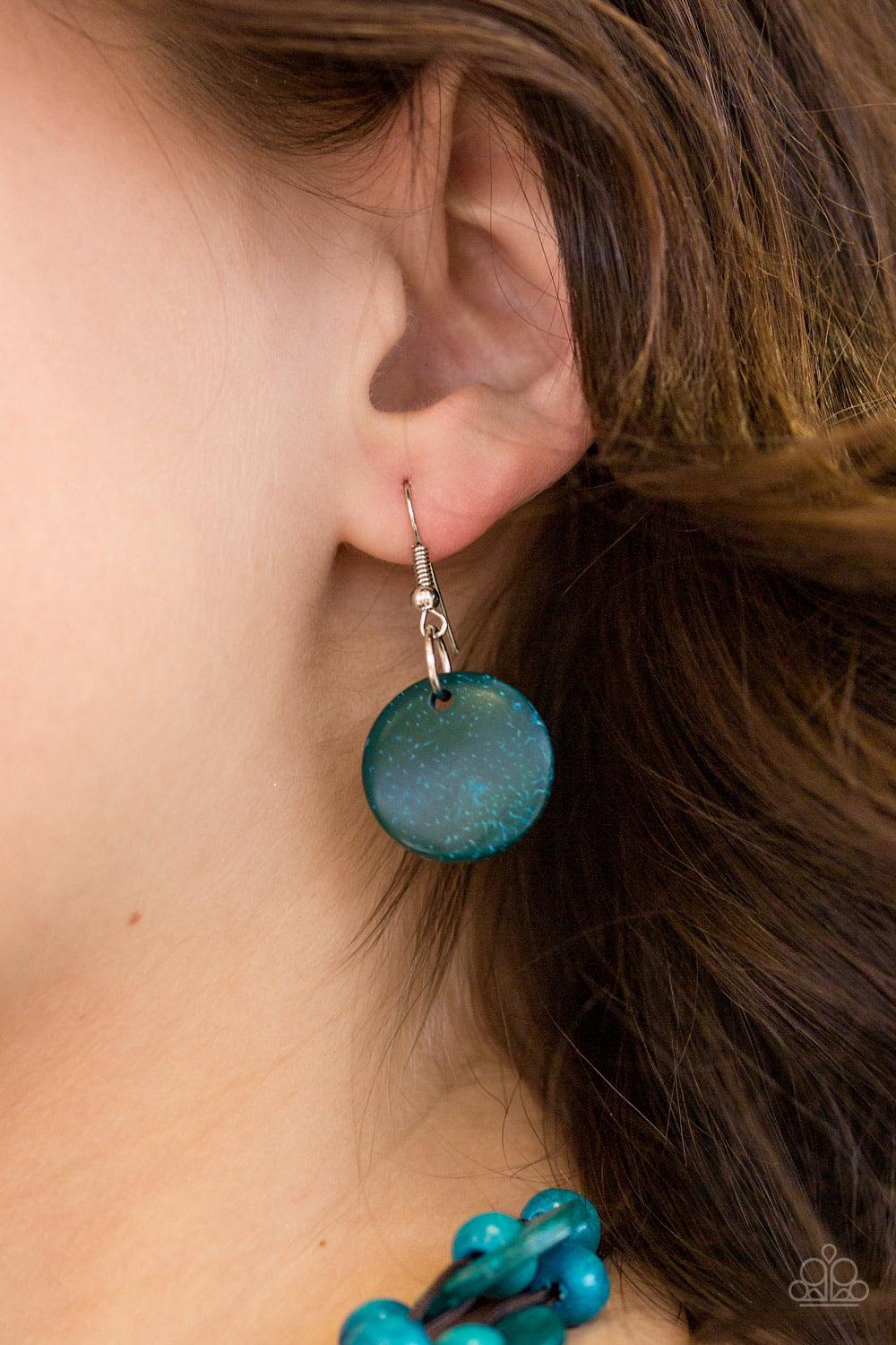 Paparazzi Accessories Bermuda Belle - Blue Brushed in a refreshing blue finish, wooden rings and beads are knotted in place along three strands, creating summery layers down the chest. Features a button loop closure. Jewelry