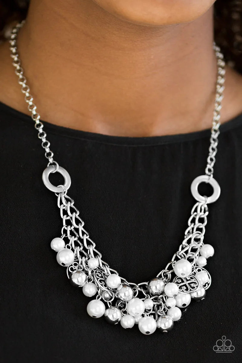 Paparazzi Accessories Cinderella Glam - White Classic white pearls, shiny silver beads, and shimmery silver accents swing from the bottom of interlocking silver chains, creating a bold fringe below the collar for a glamorous look. Features an adjustable c