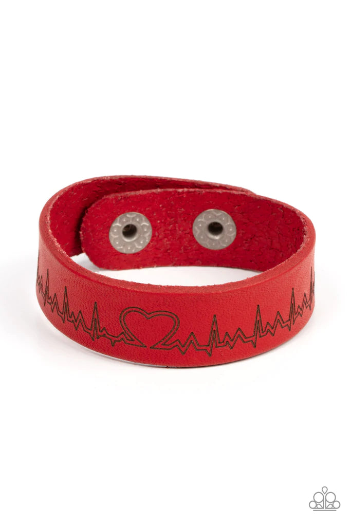 Paparazzi Accessories Haute Heartbeat - Red Culminating into a heart at the center, a zigzagging pattern reminiscent of a heartbeat is etched across the front of a red leather band around the wrist for a whimsical fashion. Features an adjustable snap clos