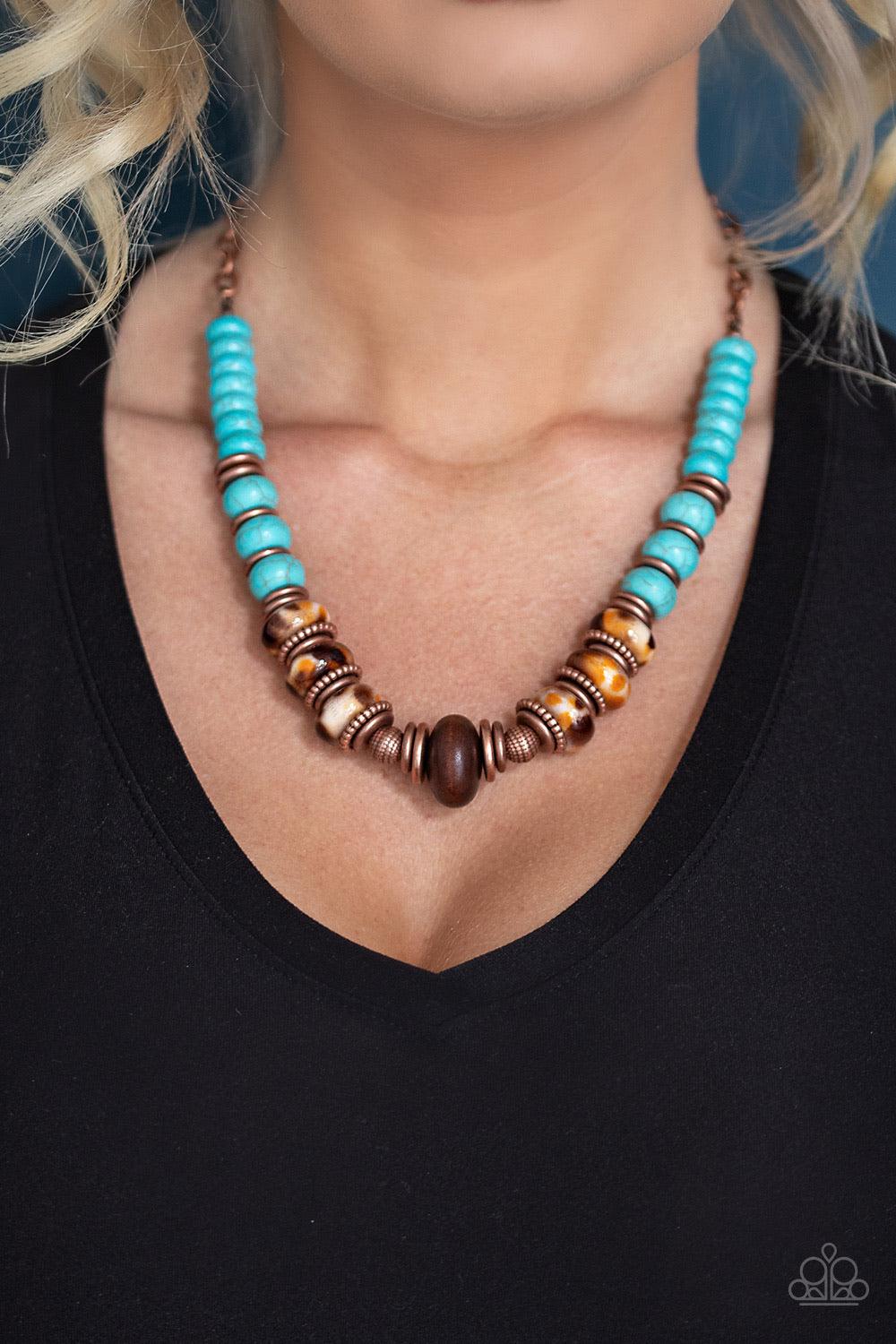 Paparazzi Accessories Desert Tranquility - Copper An earthy collection of dainty copper accents, rounded turquoise stone beads, and spotted ceramic-like beads are threaded along an invisible wire below the collar. An earthy wooden bead adorns the center,