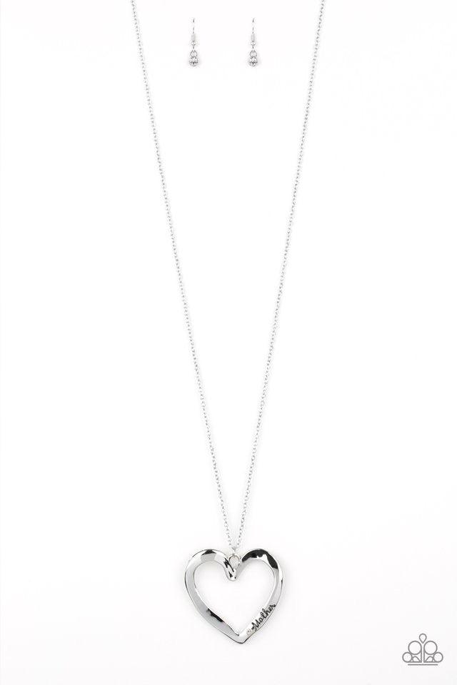 Paparazzi Accessories A Mother’s Love - Silver Swinging from the bottom of a lengthened silver chain, an asymmetrical heart pendant is stamped in the word, "mom" and dotted with a single white rhinestone for a whimsical look. Features an adjustable clasp