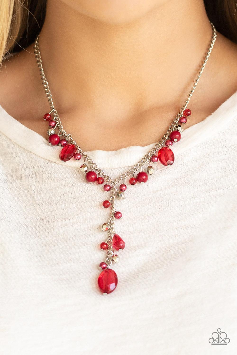 Paparazzi Accessories Crystal Couture - Red Mismatched polished red beads, crystal-like beads, and faceted silver beads dance along a shimmery silver chain. Matching beading trickles along a single silver chain, creating a romantic extended pendant below
