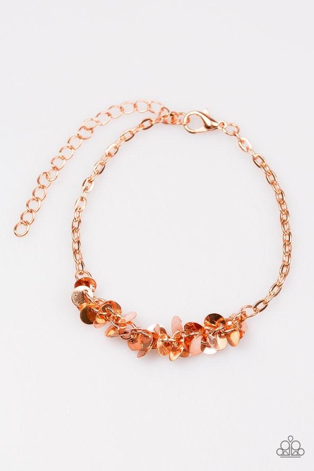Paparazzi Accessories Shimmer Train - Copper Dainty shiny copper discs trickle along the wrist, creating a flirty fringe. The flat shiny discs catch and reflect the light, creating playful movement across the skin. Features an adjustable clasp closure. Je