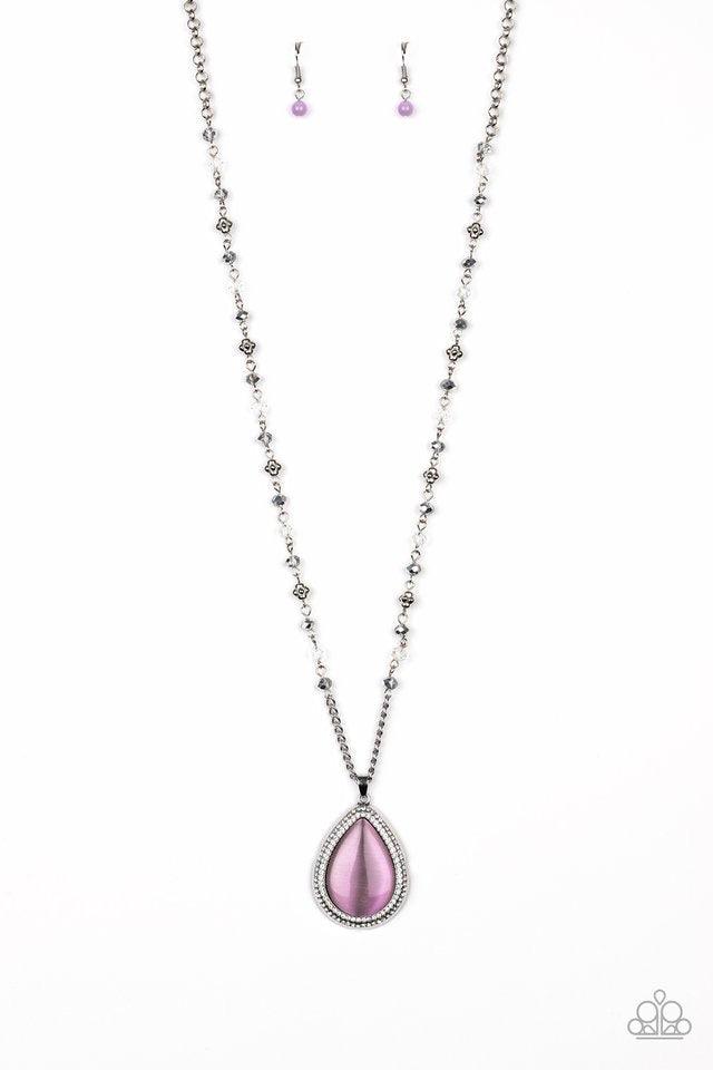 Paparazzi Accessories Fashion Flaunt - Purple Encrusted in rows of glassy white rhinestones, an imperfect silver teardrop frame is encrusted in a glowing purple cat's eye stone. The ethereal pendant swings from the bottom of a lengthened silver chain dott