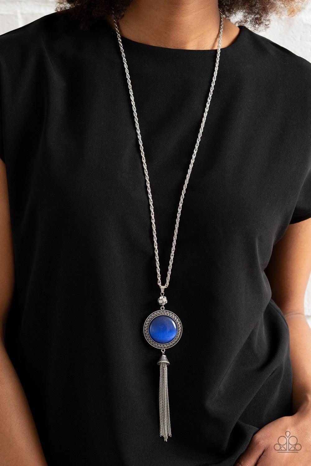 Paparazzi Accessories Serene Serendipity - Blue A glowing blue stone is set into a round silver frame hanging from a silver rope chain with chain fringe enhancing the bottom. Features an adjustable clasp. Jewelry