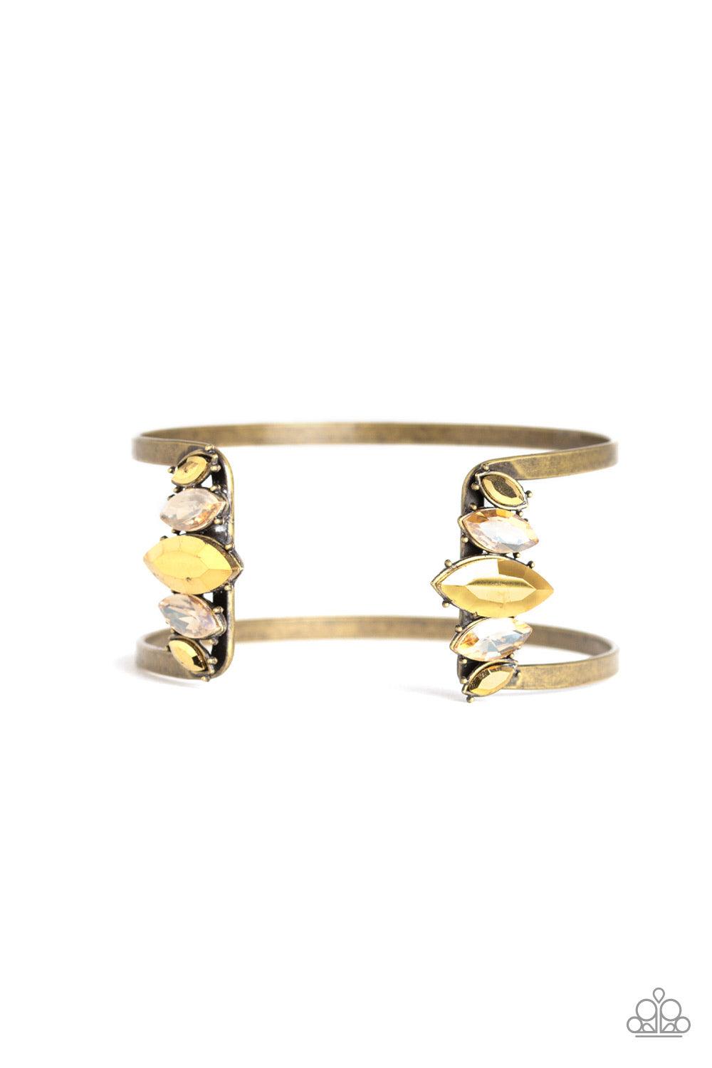 Paparazzi Accessories Glam Power - Brass Featuring regal marquise style cuts, an array of golden topaz and aurum rhinestones decorate the edges of an airy brass cuff for an edgy, glamorous finish. Jewelry
