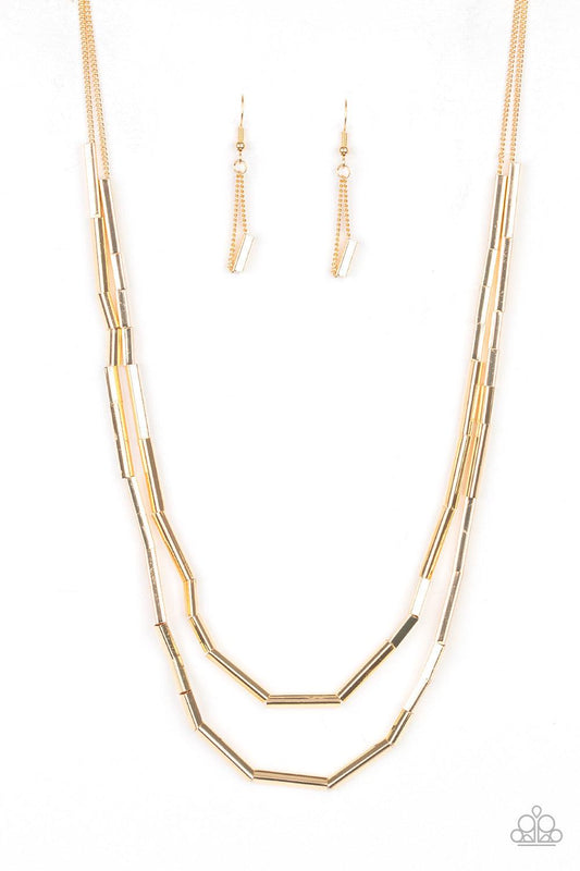 Paparazzi Accessories A Pipe Dream - Gold A collection of square rods slide along two dainty gold chains below the collar, creating edgy metallic layers. Features an adjustable clasp closure. Jewelry