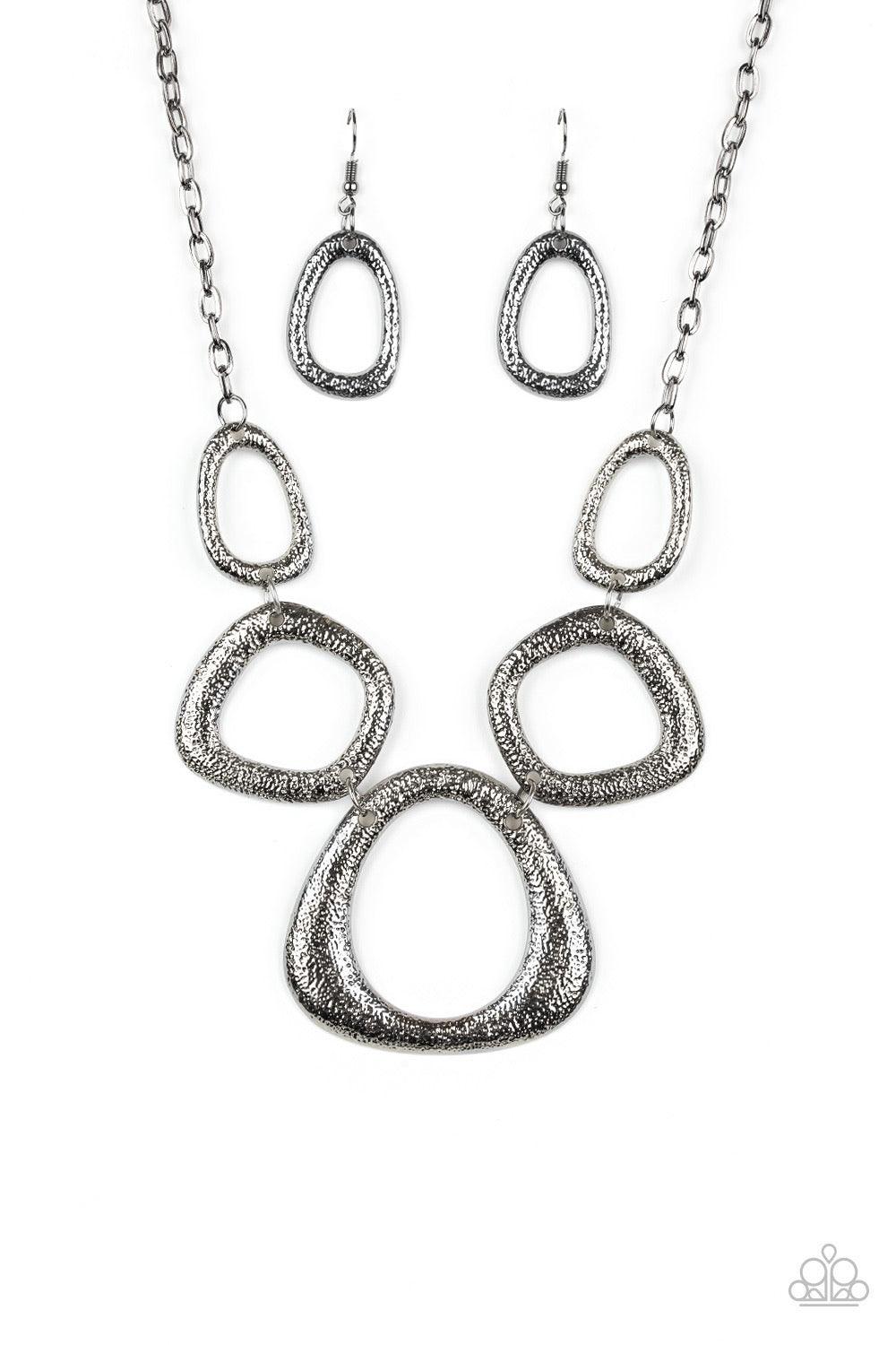 Paparazzi Accessories Backstreet Bandit - Black Hammered in a high-sheen finish, asymmetrical gunmetal frames link below the collar in an edgy statement-making fashion. Features an adjustable clasp closure. Sold as one individual necklace. Includes one pa