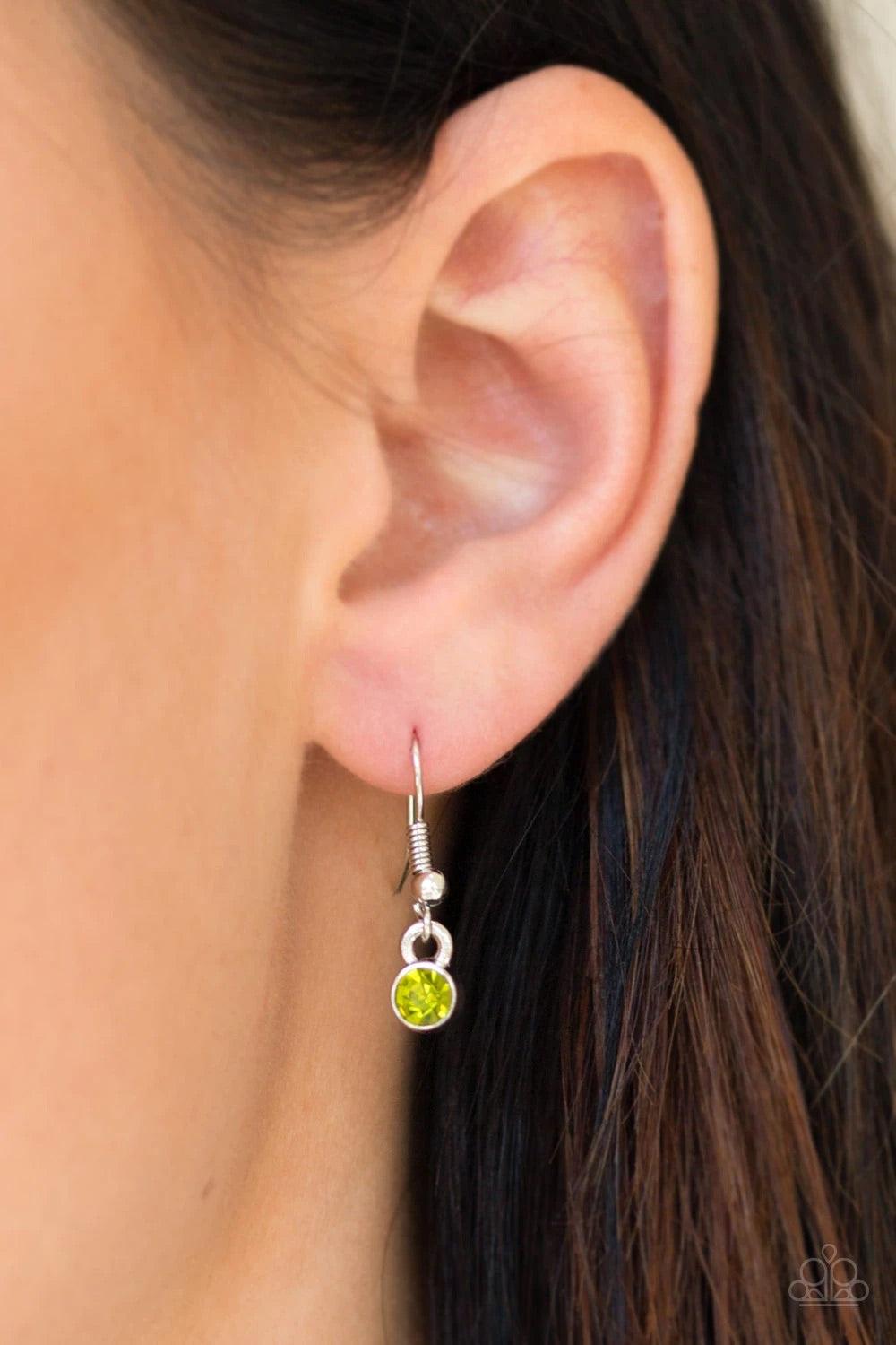 Paparazzi Accessories Sky Quest - Green Glittery green rhinestones are encrusted down the spine of a life-like silver feather. The whimsical pendant swings from the bottom of a lengthened silver chain for a seasonal look. Features an adjustable clasp clos